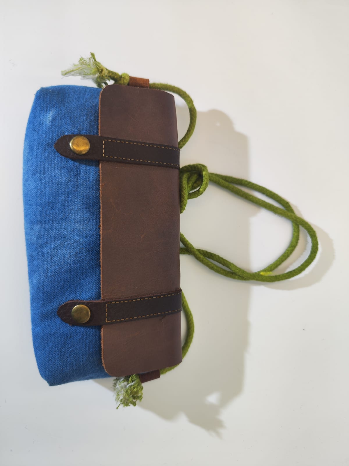Blue canvas leather-flap rope bag